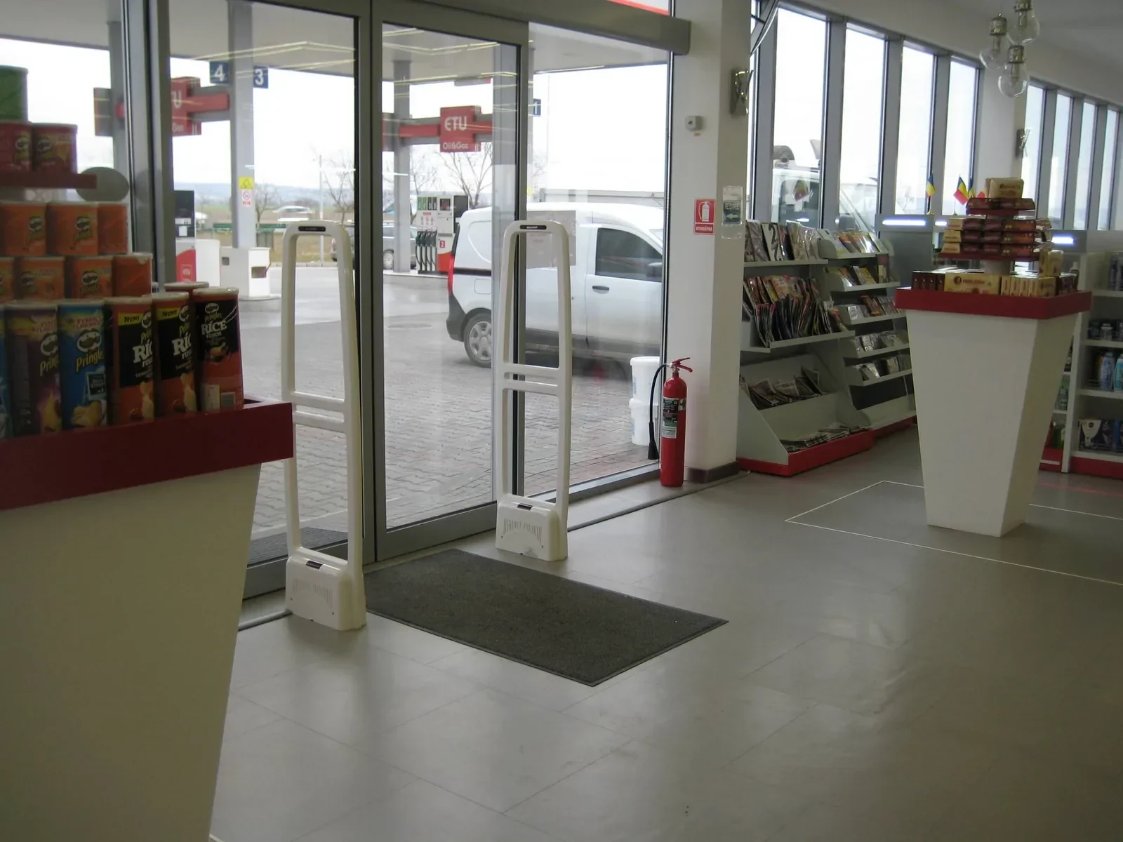 WELLPOINT anti-theft EAS pedestal pair installed at a supermarket entrance